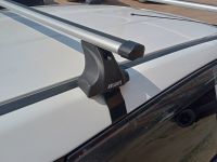 Багажник на крышу Nissan AD (Y12, 2005-...), Атлант, аэродинамические дуги Эконом, опора Е
