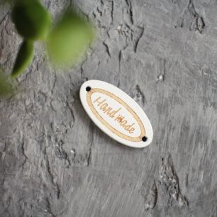 Деревянная пуговица овальная Hand made белая 27*13 мм.